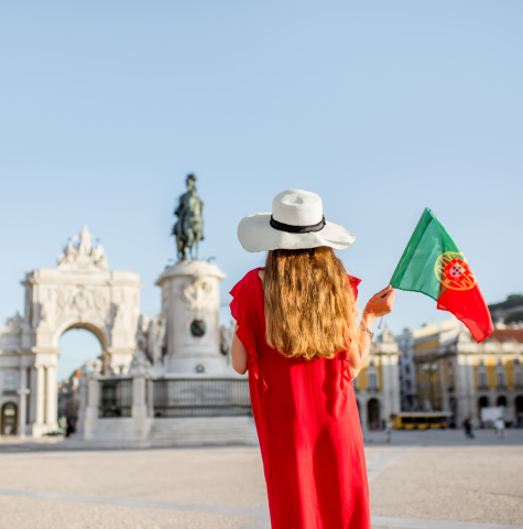 Woman standing in Portugal with Portuguese flag